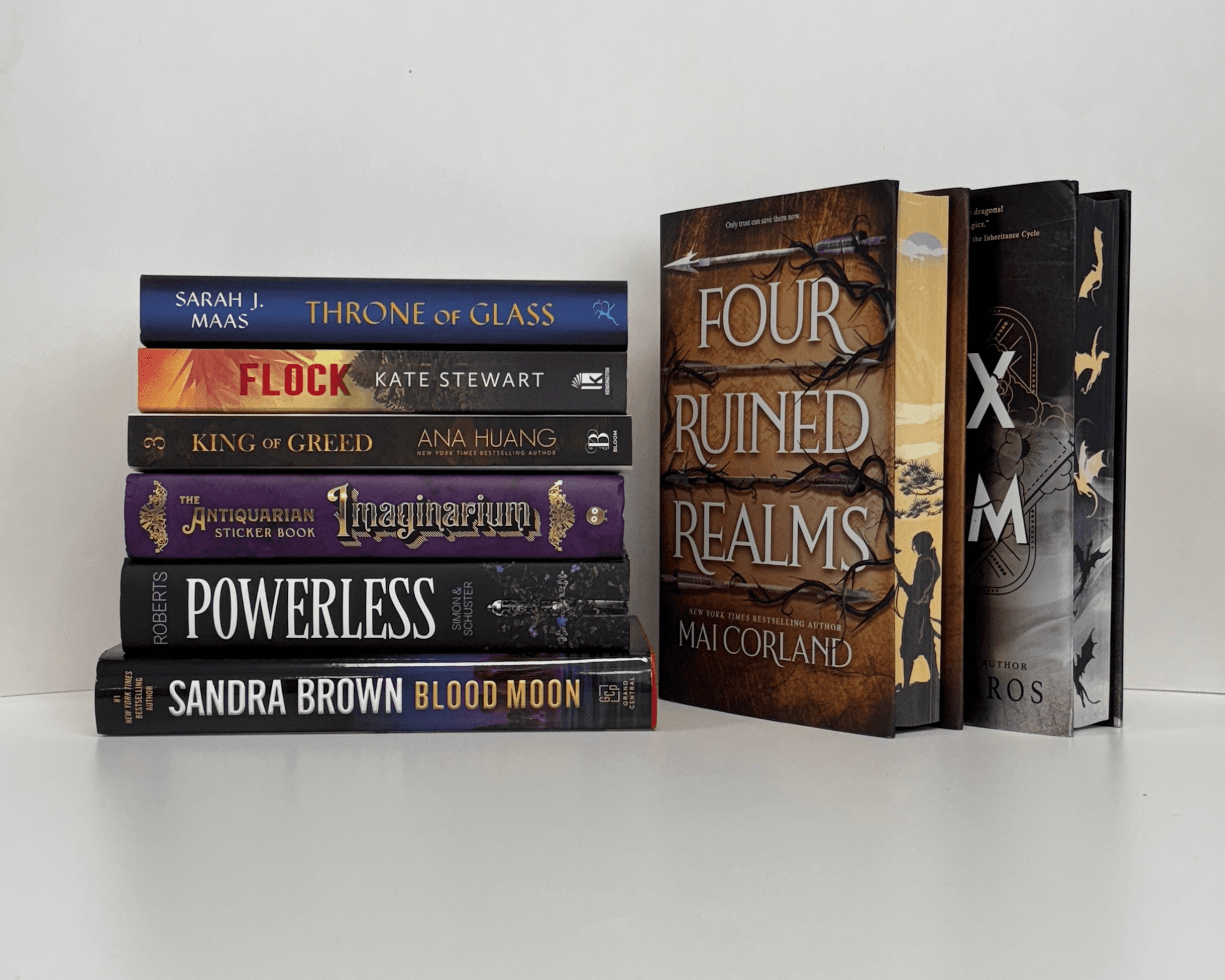 Neatly stacked books with sprayed edges showing